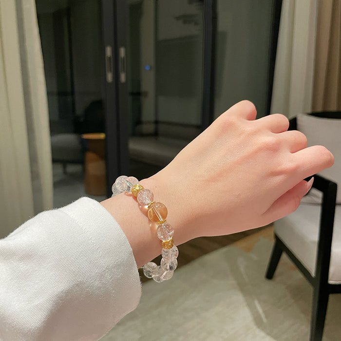 Unisex clear quartz bead bracelet on wrist