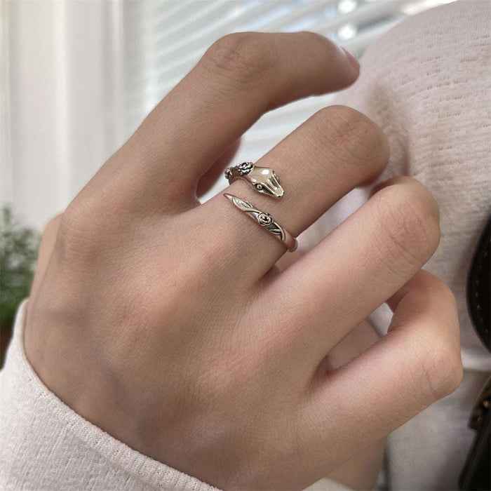 Close-up carving details on silver snake protection ring