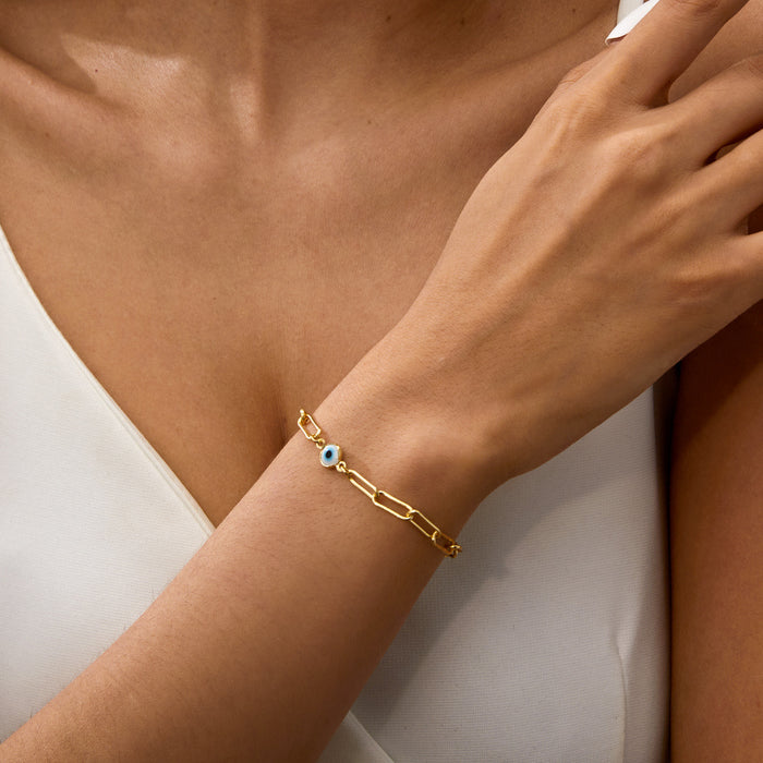 minimalist gold evil eye bracelet with blue center bead for women