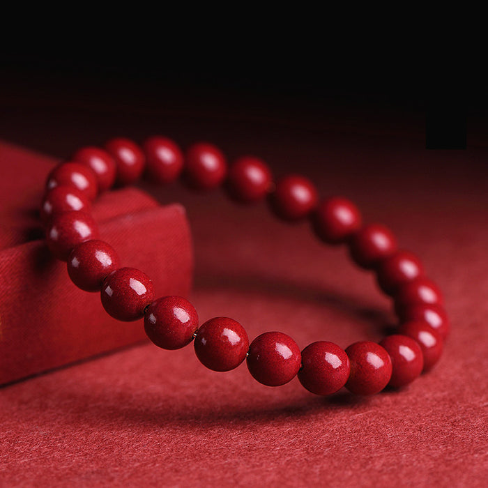 Red Bead Bracelet Symbolizing Good Luck and Strength