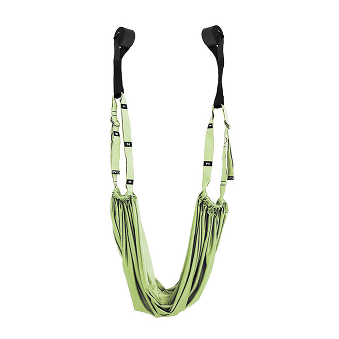 Green suspension training strap with black hooks on a white background