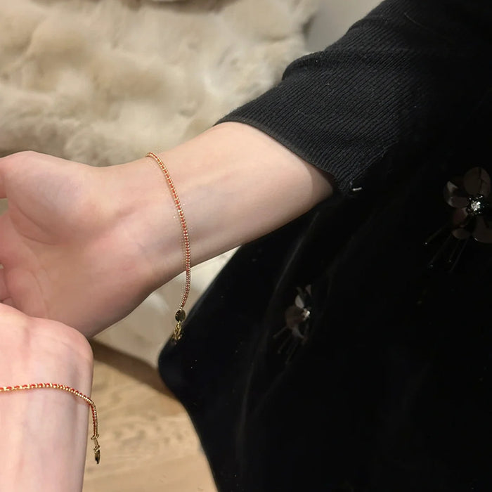 Thin Red String Bracelet with Gold Thread Accent