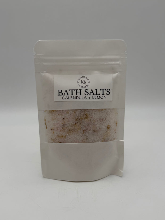 Package of bath salts with a visible brand label on a white background