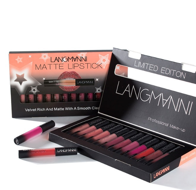 A set of Langmanni brand matte lipsticks in various colors, displayed alongside a box that highlights the product features such as being waterproof, long-lasting, and having a smooth application. The packaging is predominantly black with the brand name prominently displayed.