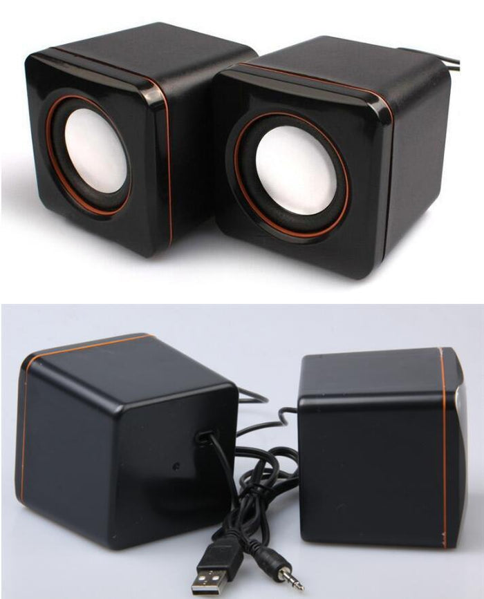 A pair of black mini portable USB wired desktop speakers with volume control knobs and a USB cable.