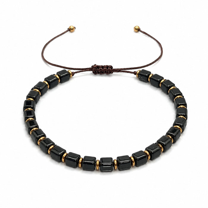 Black obsidian bracelet for men featuring square cube bead design on a white background
