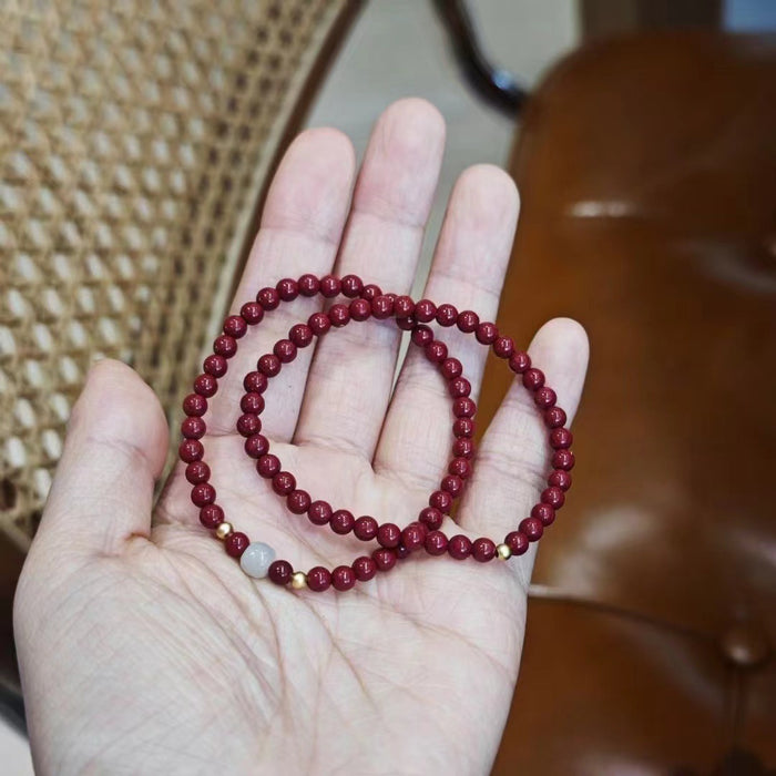 cinnabar and jade healing bracelet with 925 silver spacer