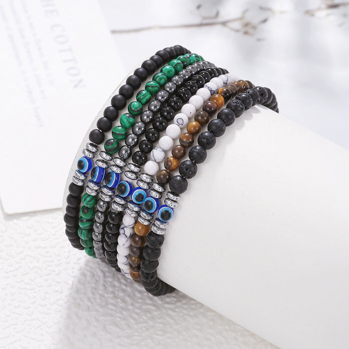 Close-up of natural Tiger Eye gemstone beads and Evil Eye charm bracelet for men