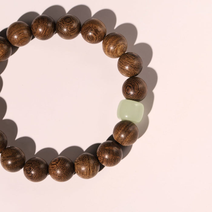 Handmade wooden bead bracelet crafted with natural wood and Hetian Jade