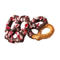 Two dark chocolate covered pretzels with peppermint pieces on a white background