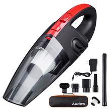 Handheld vacuum cleaner with attachments on a white background