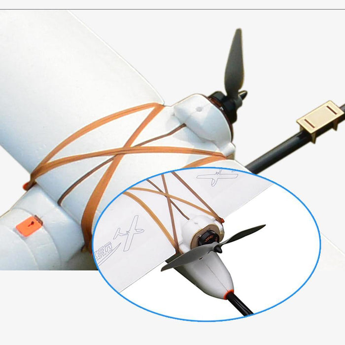 White fixed-wing drone with propeller and orange straps, ideal for surveying and mapping missions