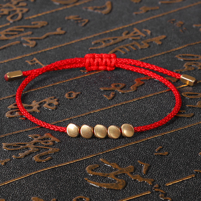 Tibetan Buddhist red string bracelet with symbolic design