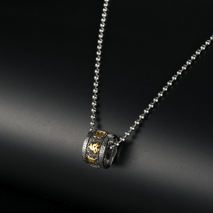 Close-up of Engraved Tibetan Mantra on Titanium Cylinder Pendant