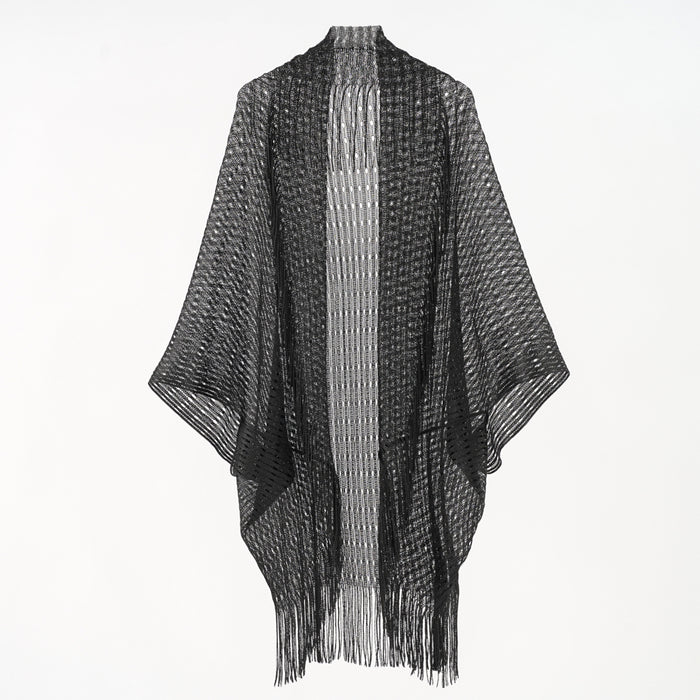 Black and white poncho with fringe on a white background