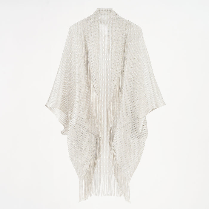 Beige knitted poncho on a white background